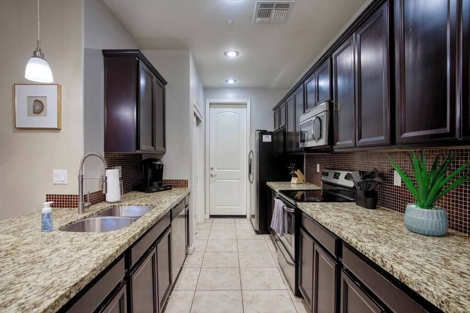 Granite counters and island seating for easy dining.