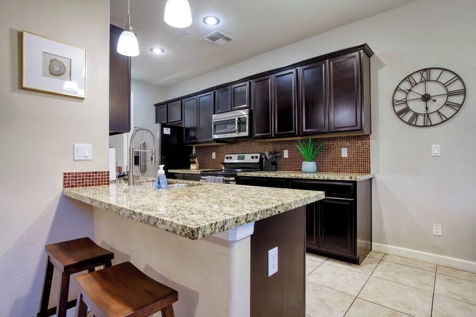 Fully equipped kitchen with modern appliances.