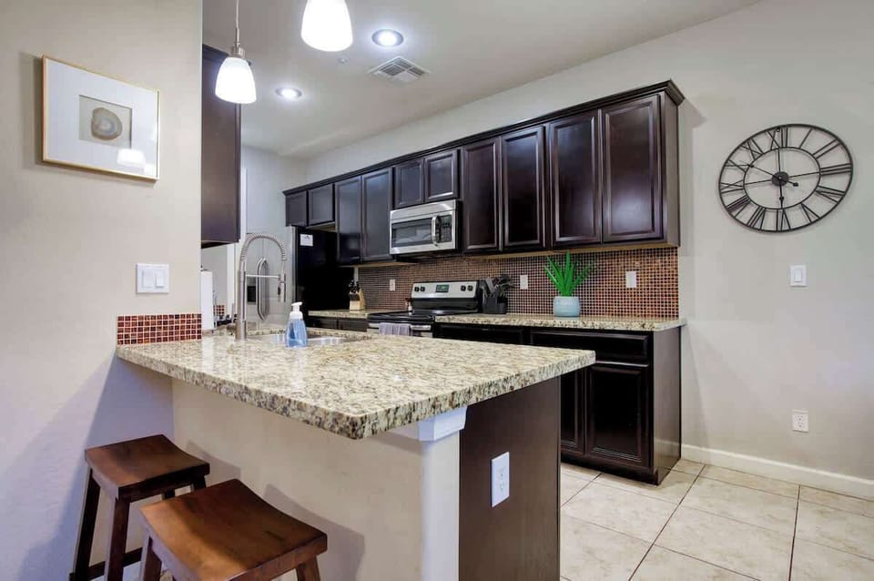 Cook with ease in a modern kitchen with granite counters