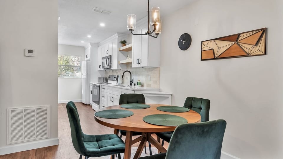 This charming dining area sits between the kitchen and living room, offering a cozy spot for meals or conversation. Its central location keeps you connected to cooking and relaxation in a seamless flow.