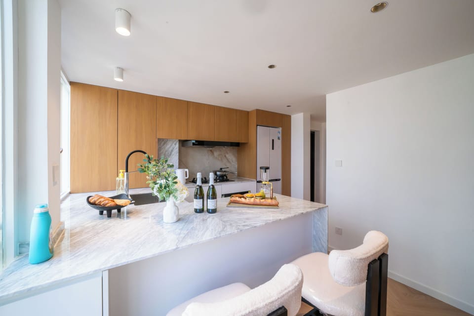 Elite Apartment | Private kitchen | Cleaning supplies, paper towels