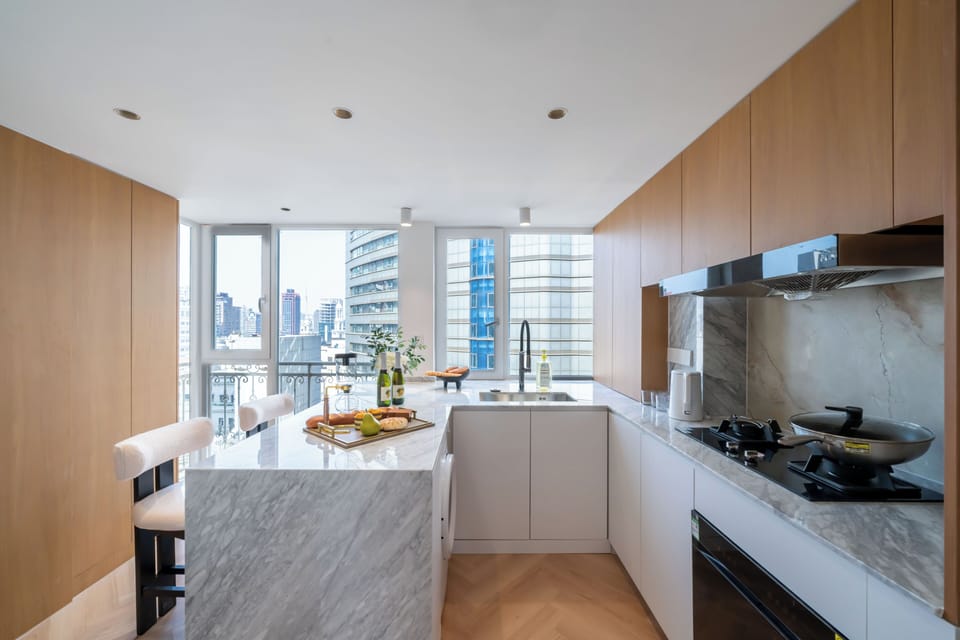 Elite Apartment | Private kitchen | Cleaning supplies, paper towels