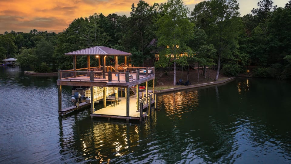 Stunning two story boathouse with jump platform, hammock, green light and views.