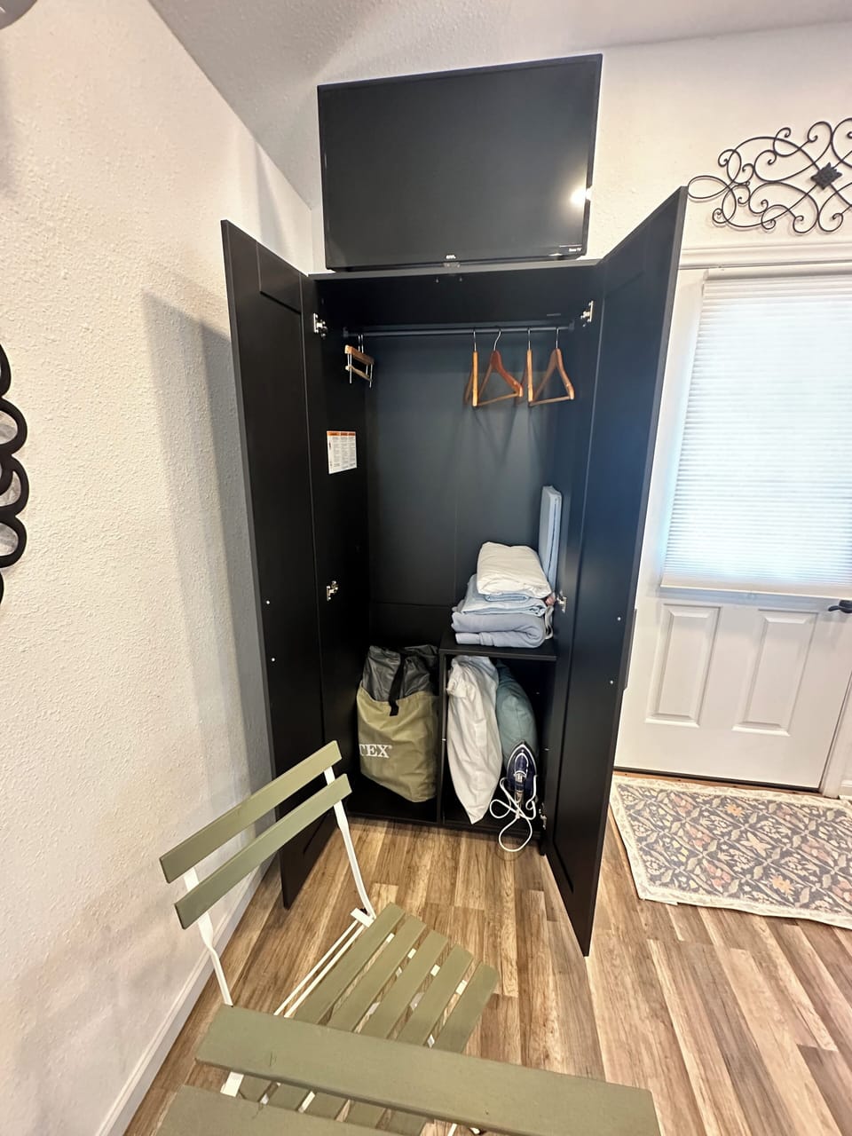 Spacious wardrobe with an air mattress available