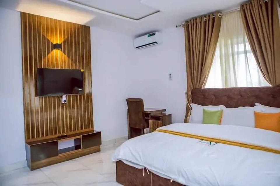 Deluxe Room, Balcony, City View | Desk, laptop workspace, blackout drapes, soundproofing