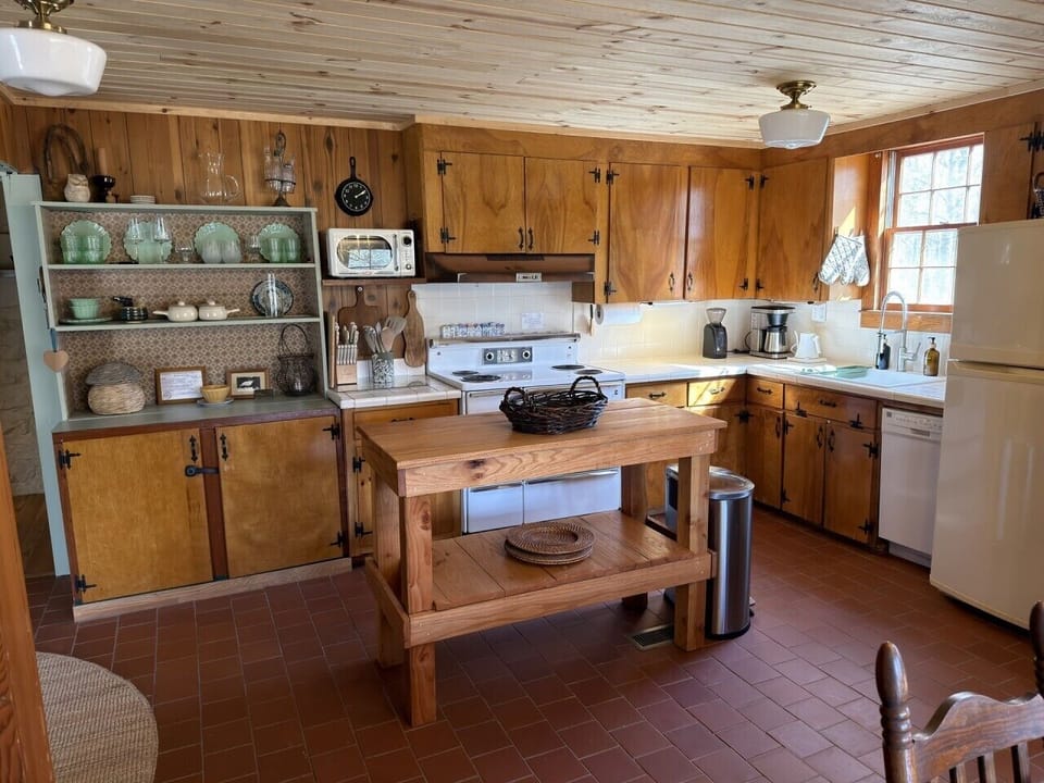Gather, cook, and make memories in the fully equipped rustic kitchen.