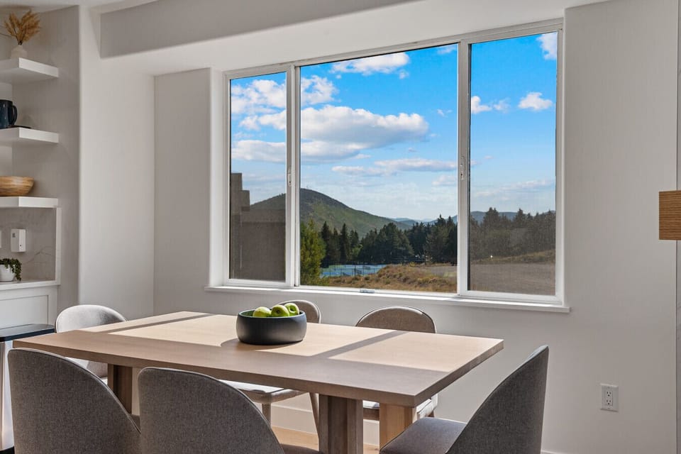 Dining area with comfortable seating for 6 in front of mountain views