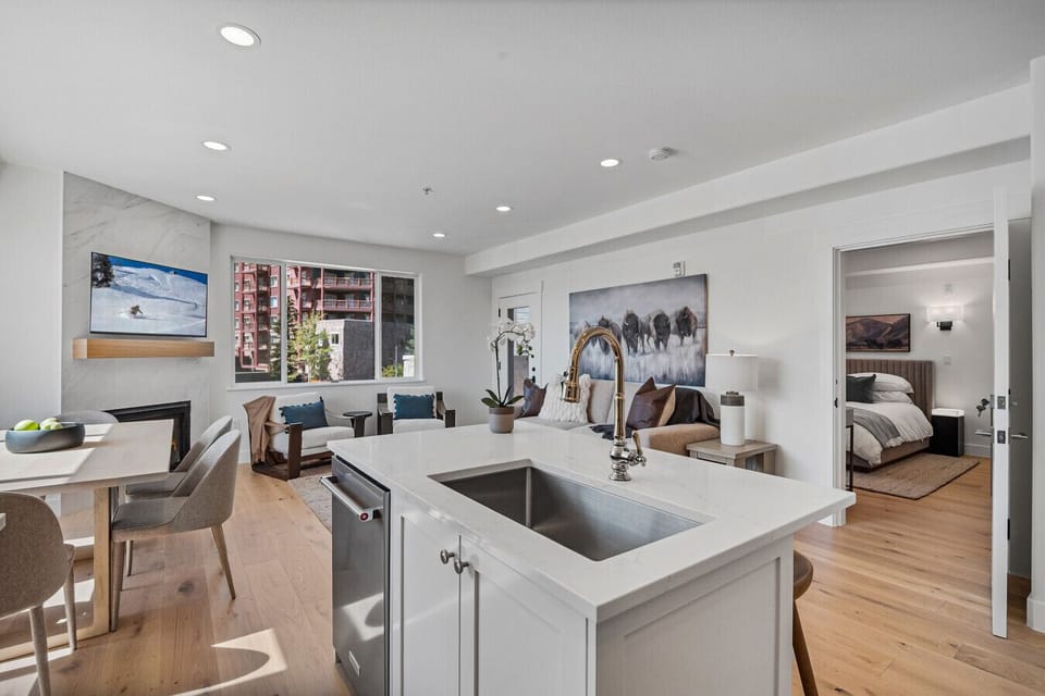 Open kitchen off living room with grand views of the mountains