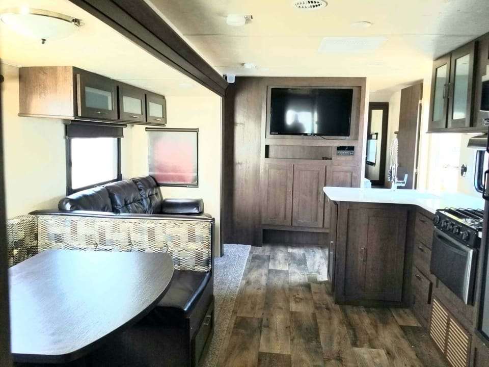 Full kitchen inside, with dinette table