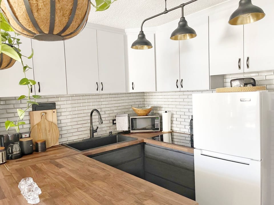 Kitchen with oven, stove and microwave. 