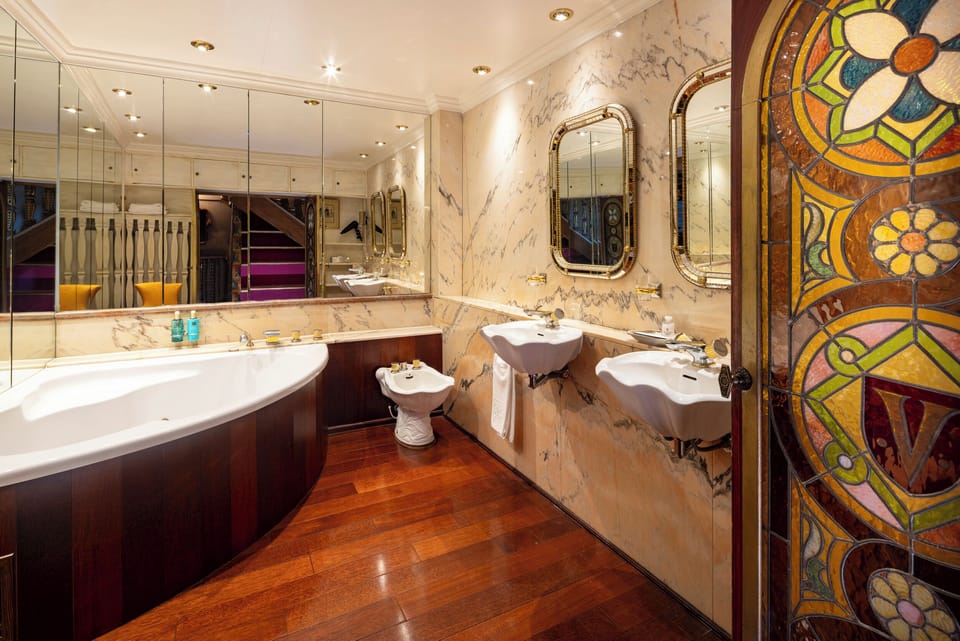 Grand Room, Multiple Beds | Bathroom | Eco-friendly toiletries, hair dryer, bathrobes, slippers