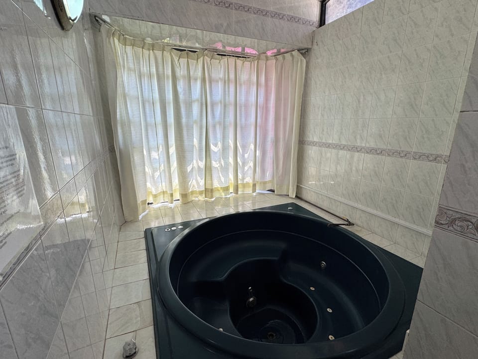 Senior Studio Suite | Bathroom | Shower, towels, soap, shampoo