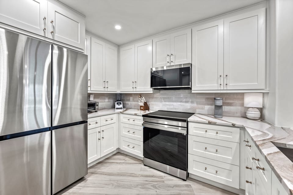 Gather, sip, and savor in a kitchen made for vacation living—bright, modern, and just steps from sunset dinners on the lanai.