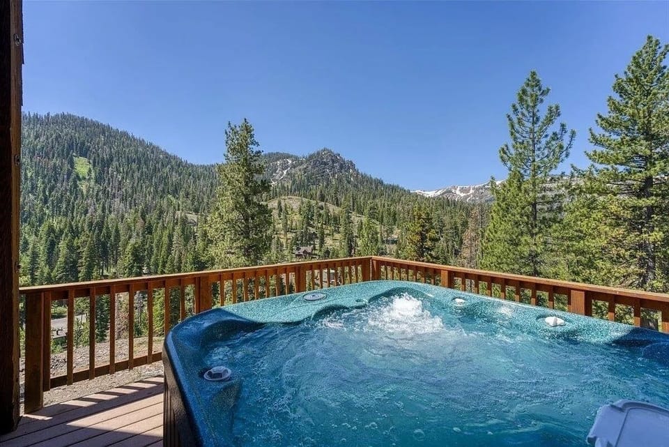 Hot tub on the deck off main living room with sweeping views