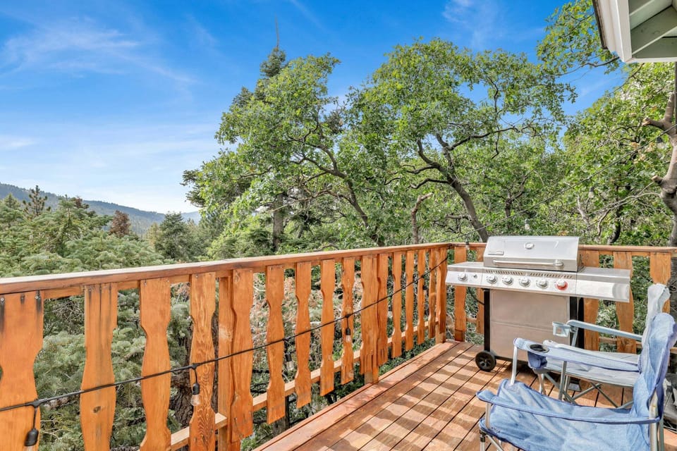“Spacious deck with BBQ and seating, perfect for outdoor dining and relaxation while enjoying fresh air and stunning views.