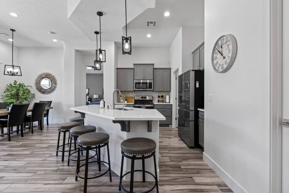 Bar seating and kitchen.