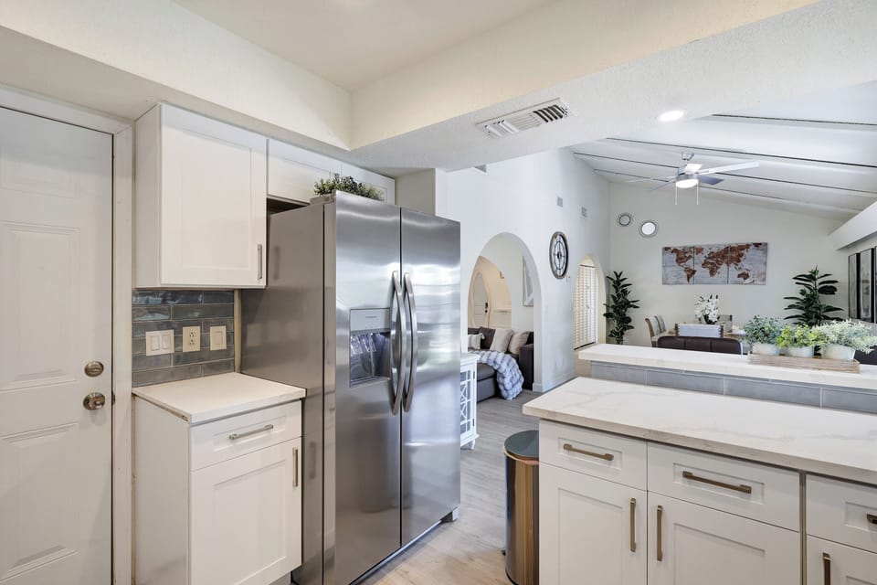 Stainless steel appliances. Fridge dispenses water and ice.