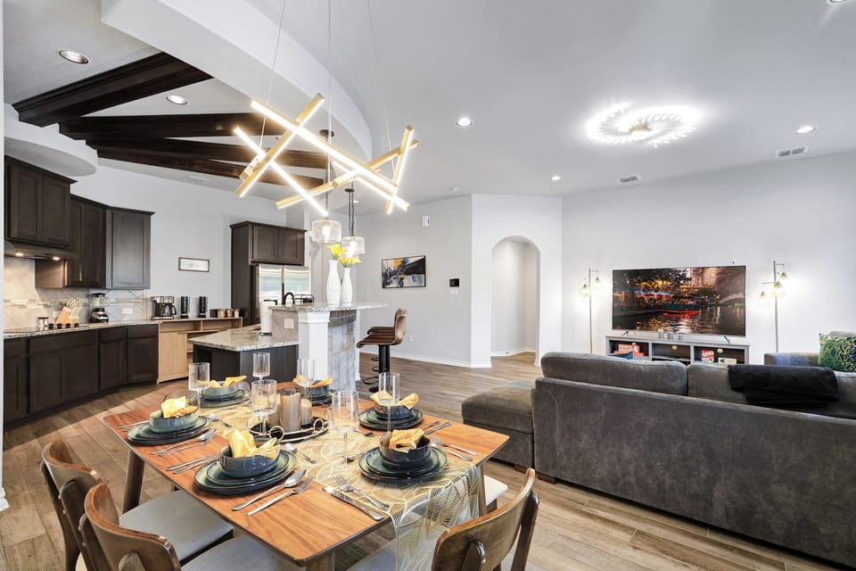 Spacious dining table that sits 6 with full tableware and silverware included. 