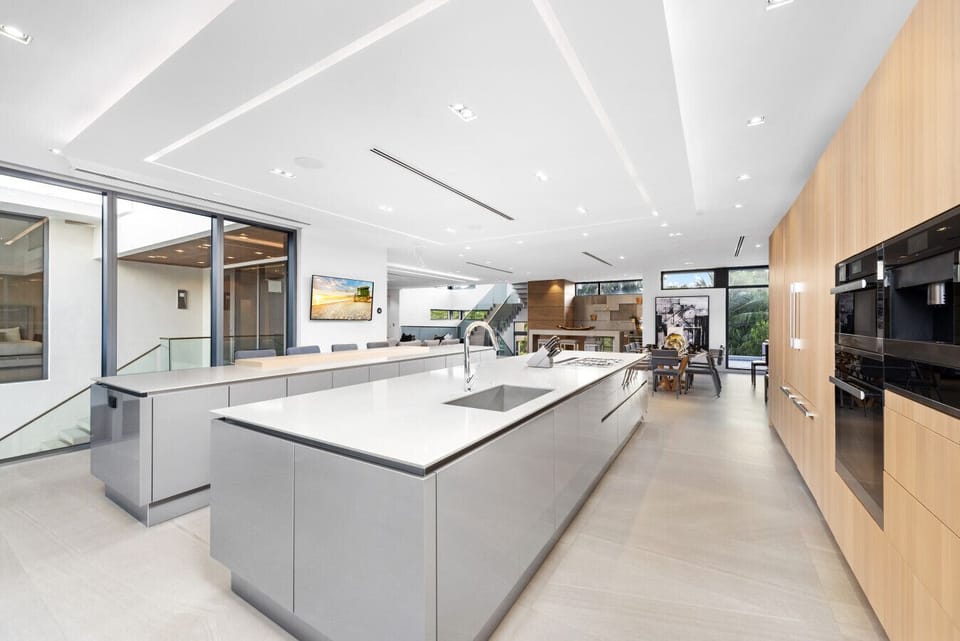 Spacious modern kitchen offering ample prep space, top appliances, and inviting island counter