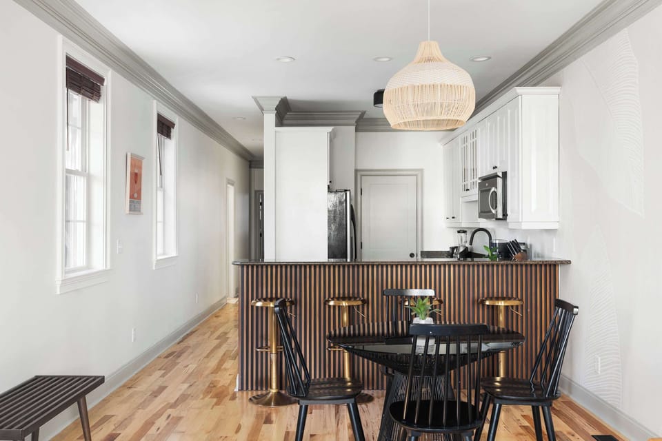 Fully equipped kitchen with bar top seating. Entertainment space, and open concept living room / kitchen.