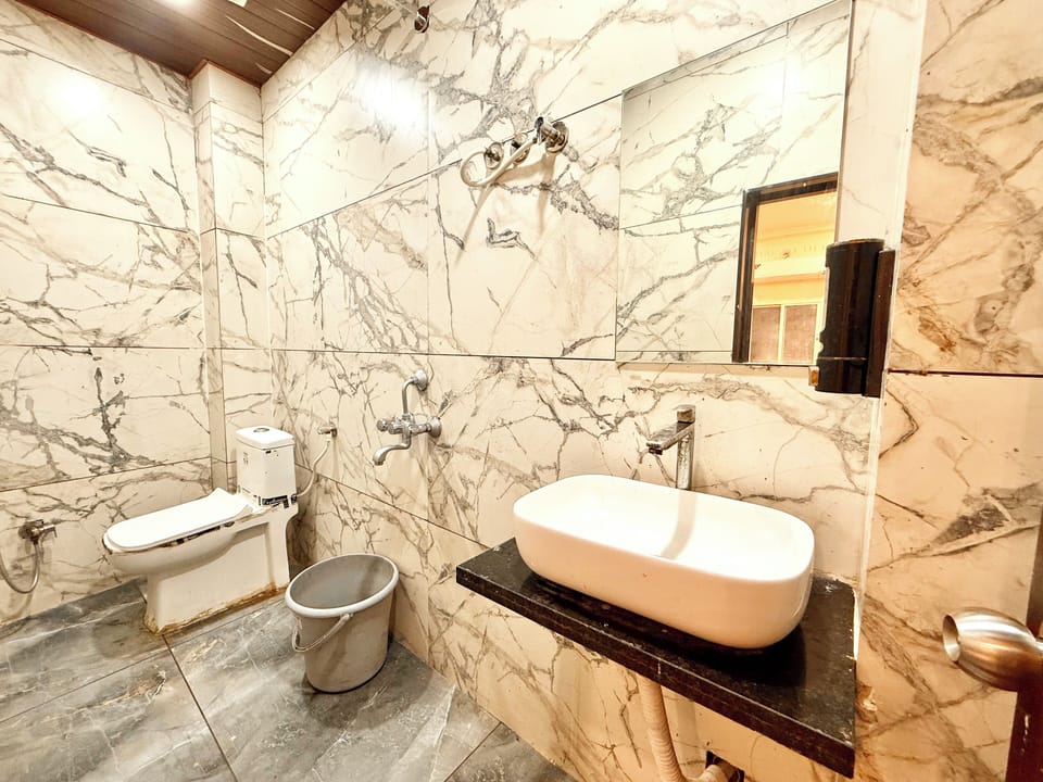 Shower, rainfall showerhead, bidet, towels