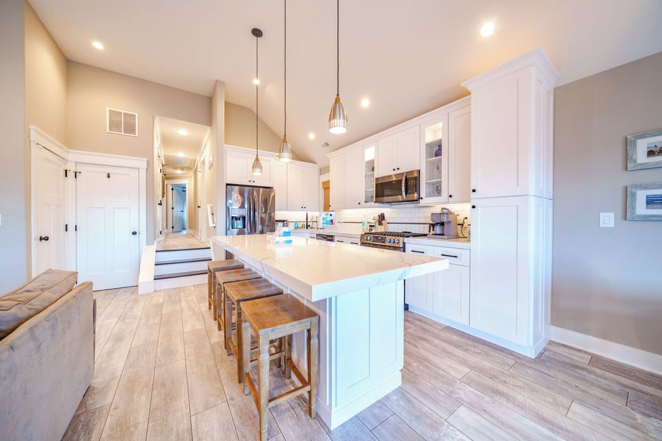 Modern kitchen with a central island and seating for four.
