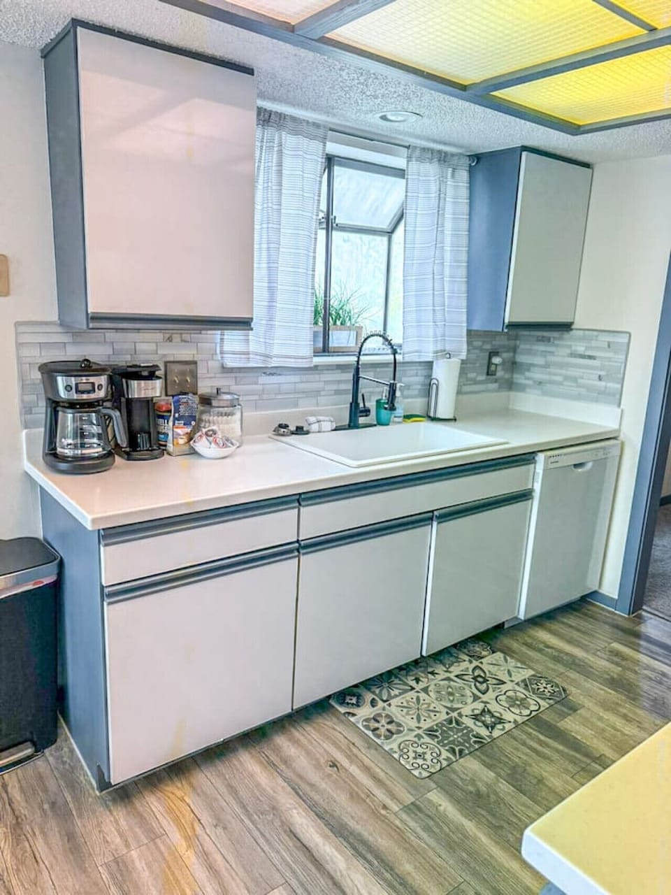Modern lake condo kitchen with updated appliances and bright, functional design.