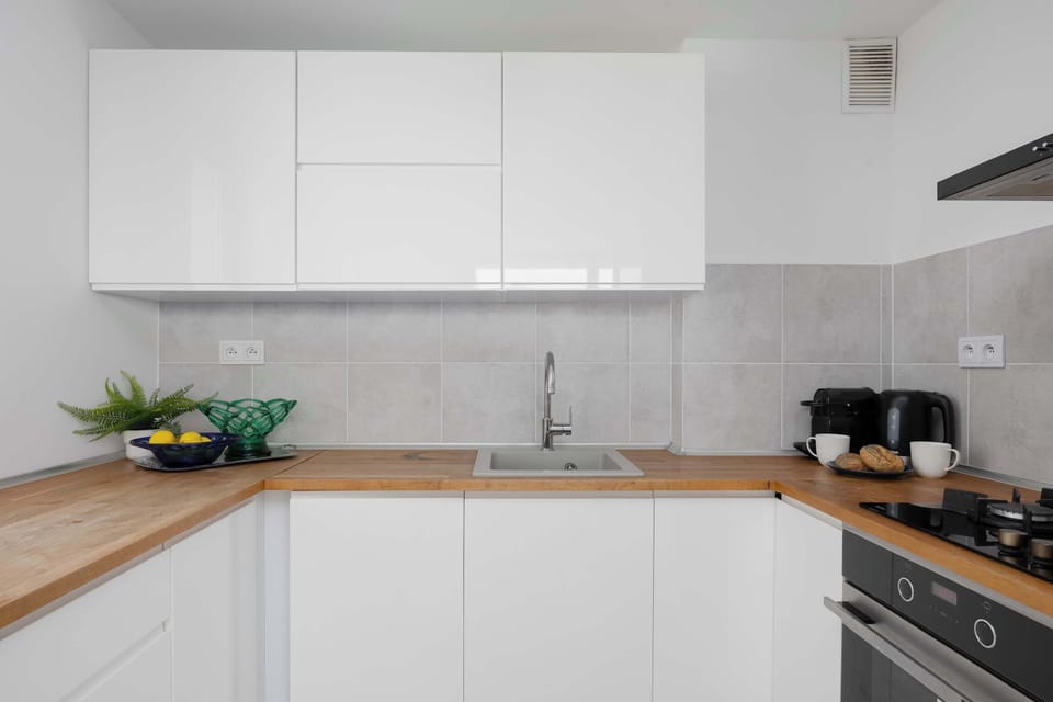 Cook and dine in style with the modern kitchenette and dining area.