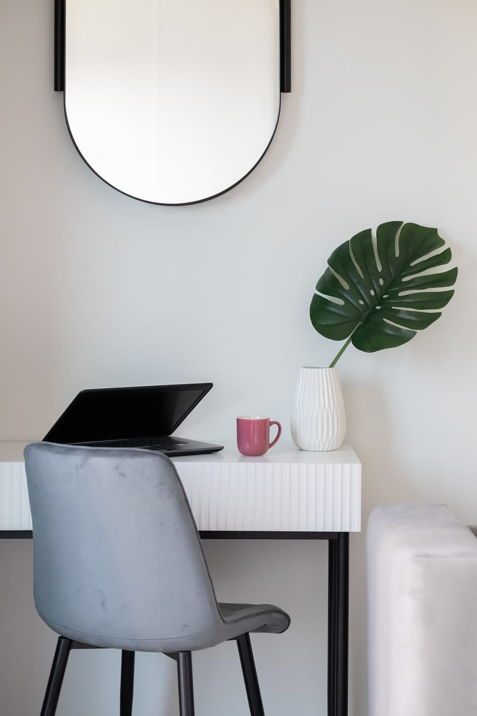 The desk with a mirror and decorations is a perfect spot both for work and for morning routines.