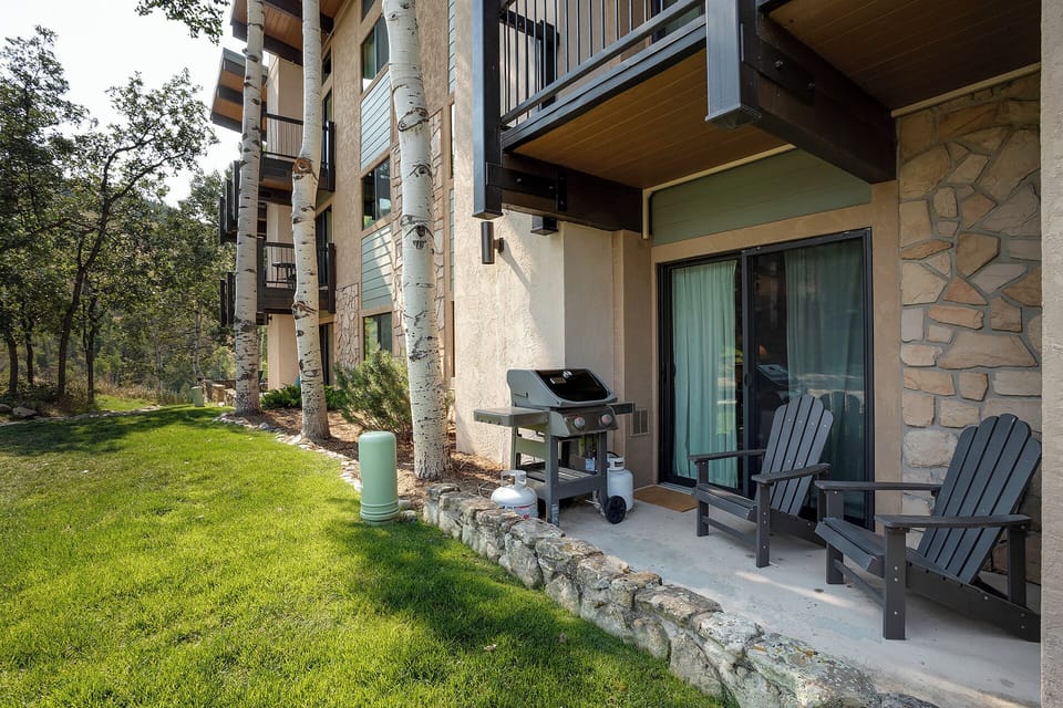 Unwind on your private patio with comfortable Adirondack chairs and your own BBQ grill, perfect for morning coffee or evening grilling sessions.