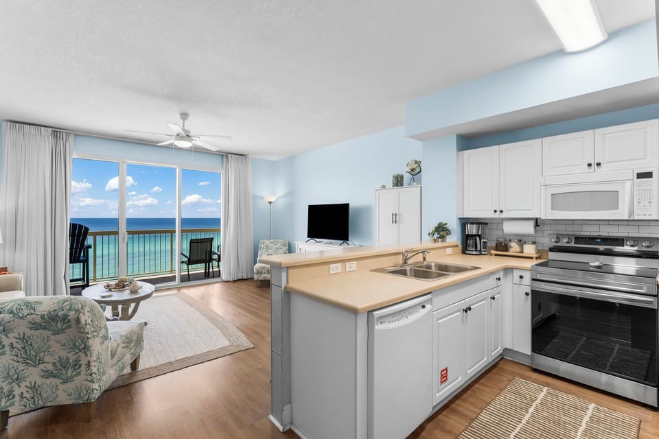 Relax in this coastal kitchen and living area with ocean views and natural light.