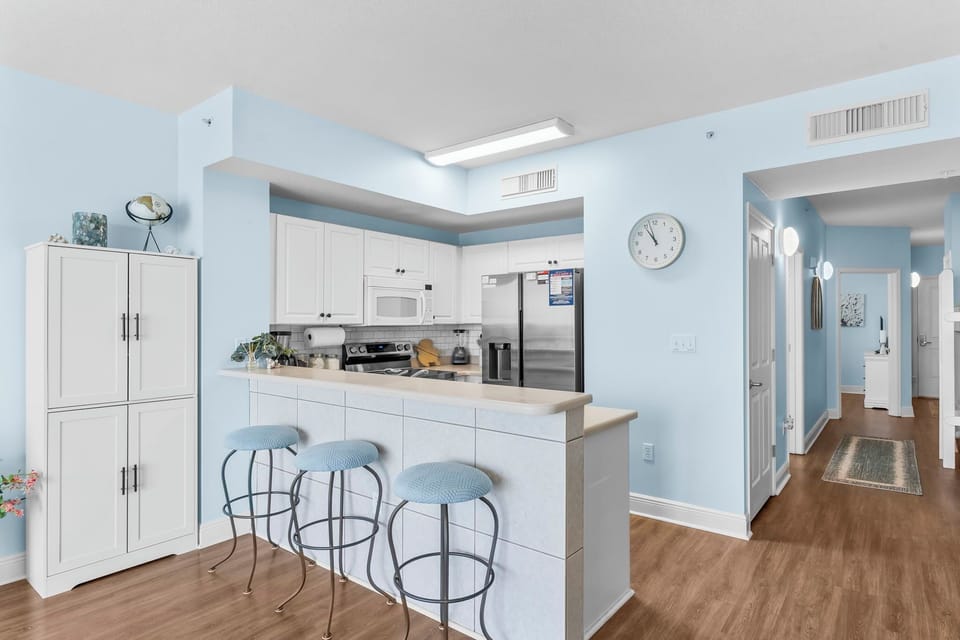 Light-filled kitchen with a breakfast bar and modern appliances