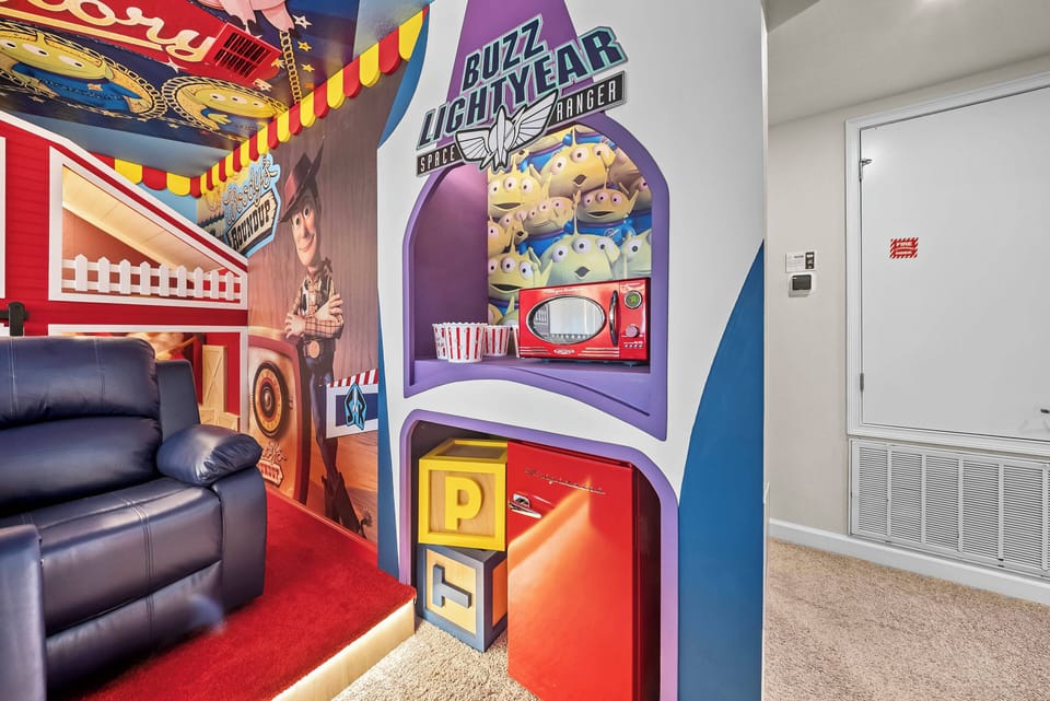 Welcome to a vibrant Buzz Lightyear-themed play space, where bright colors and fun decor set the mood. The soft carpet invites you to relax, and the cozy recliner is perfect for movie nights or gaming adventures.