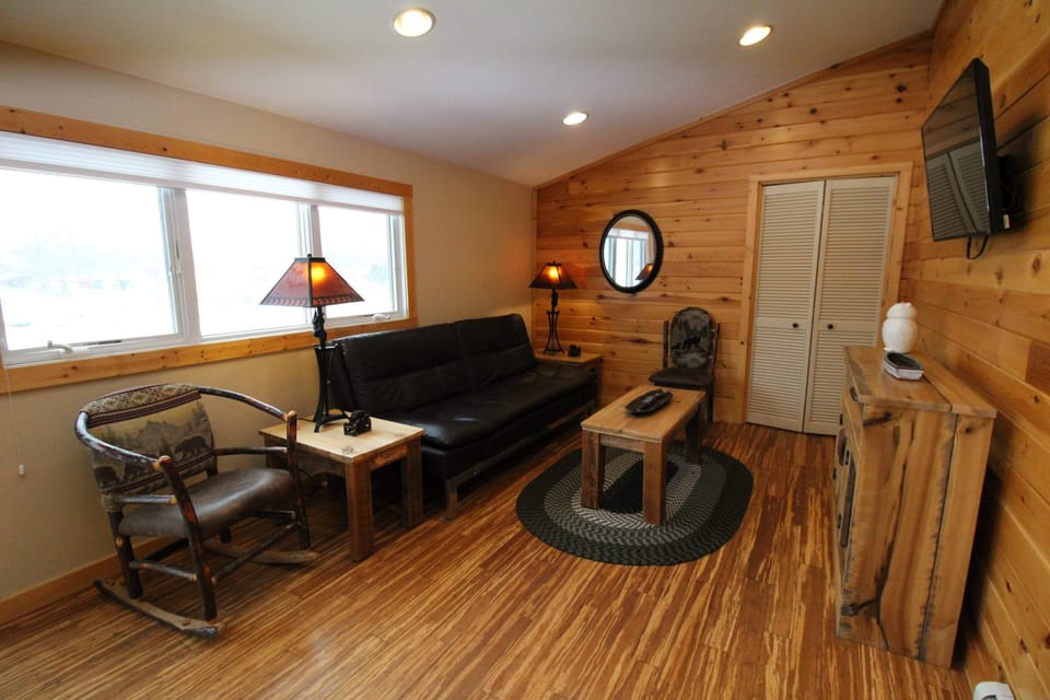 Family Suite, Lake View | Living area | 43-inch TV with cable channels