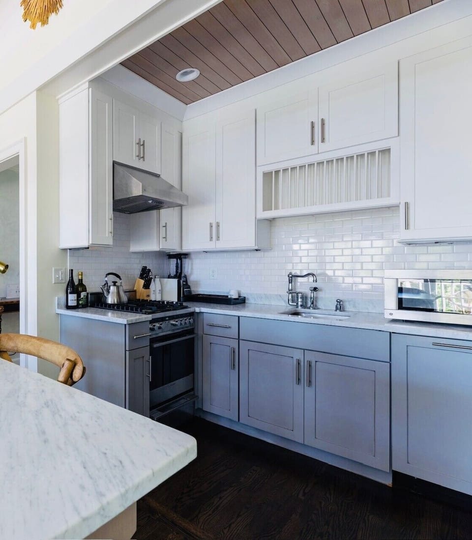 Gourmet kitchen featuring marble countertops and premium appliances