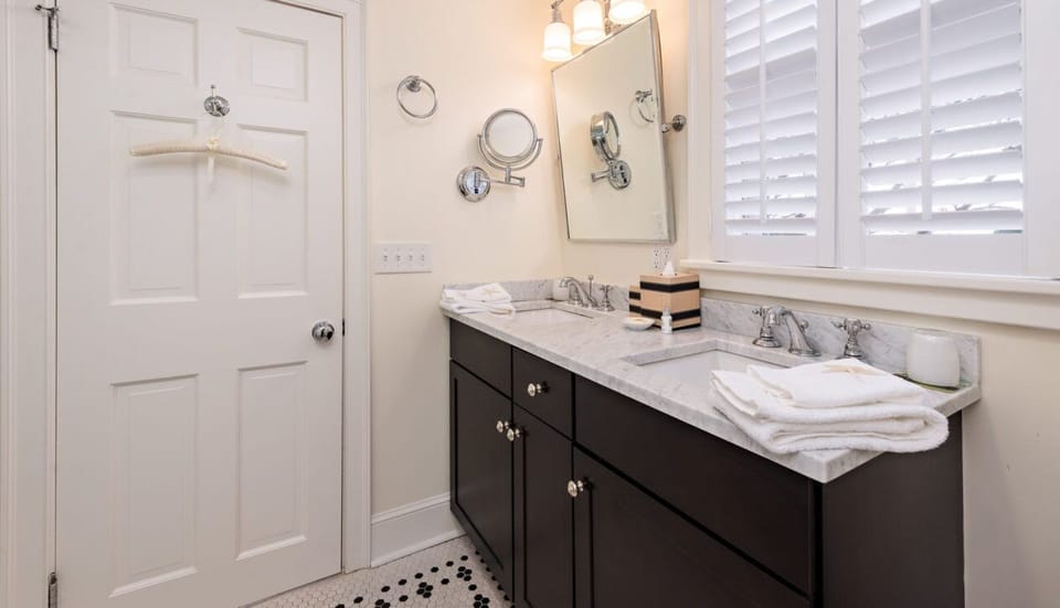 “Bright master bathroom with luxury touches and timeless coastal style.”