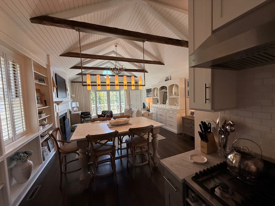 Open kitchen flows seamlessly into the dining and living spaces.