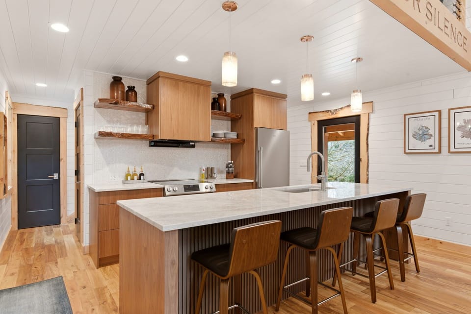 Gather around the island for easy breakfasts, evening drinks, or a relaxed night in.