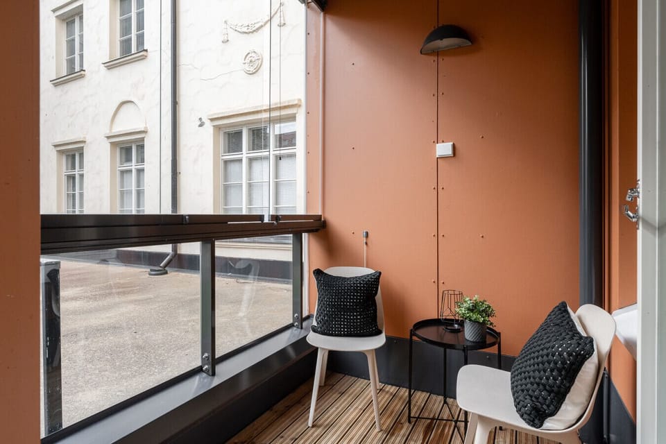 Take your morning coffee out to the glazed balcony, offering a sheltered and cozy spot to enjoy the fresh air year-round.