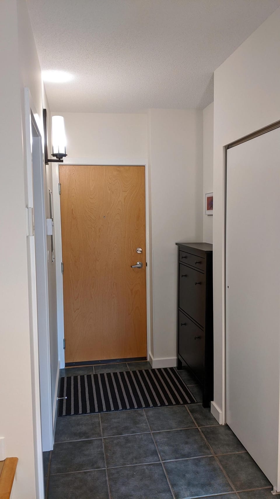 Secure front entry hallway providing smooth access into the main residence.