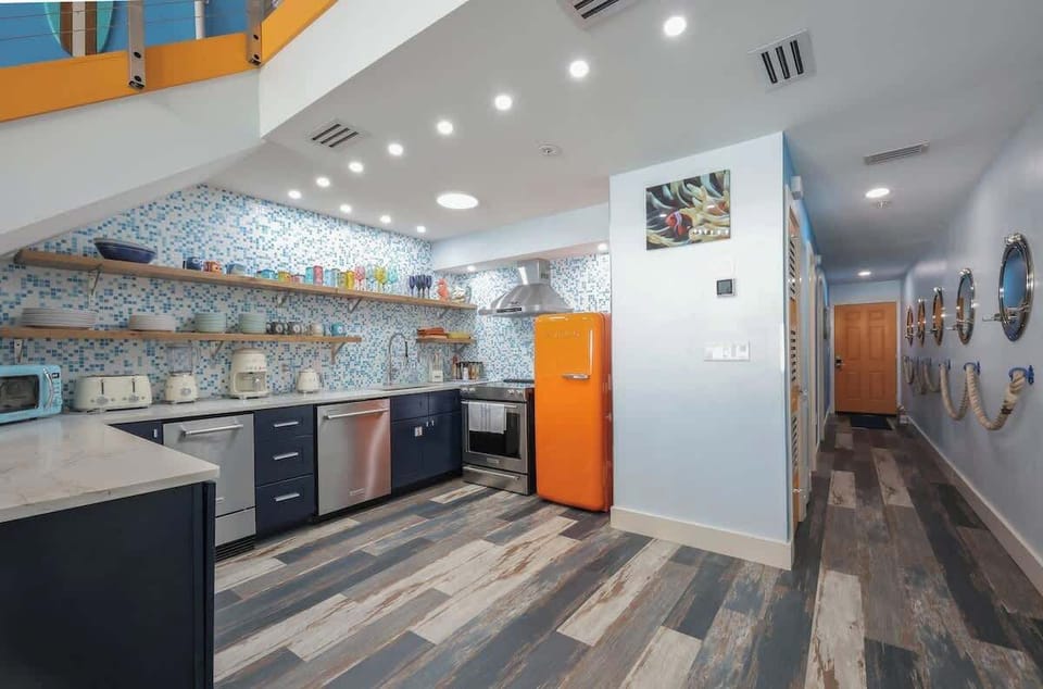 Luxury appliance lineup: iconic Smeg style paired with KitchenAid performance  a gorgeous, high-end kitchen made for both cooking and showing off.