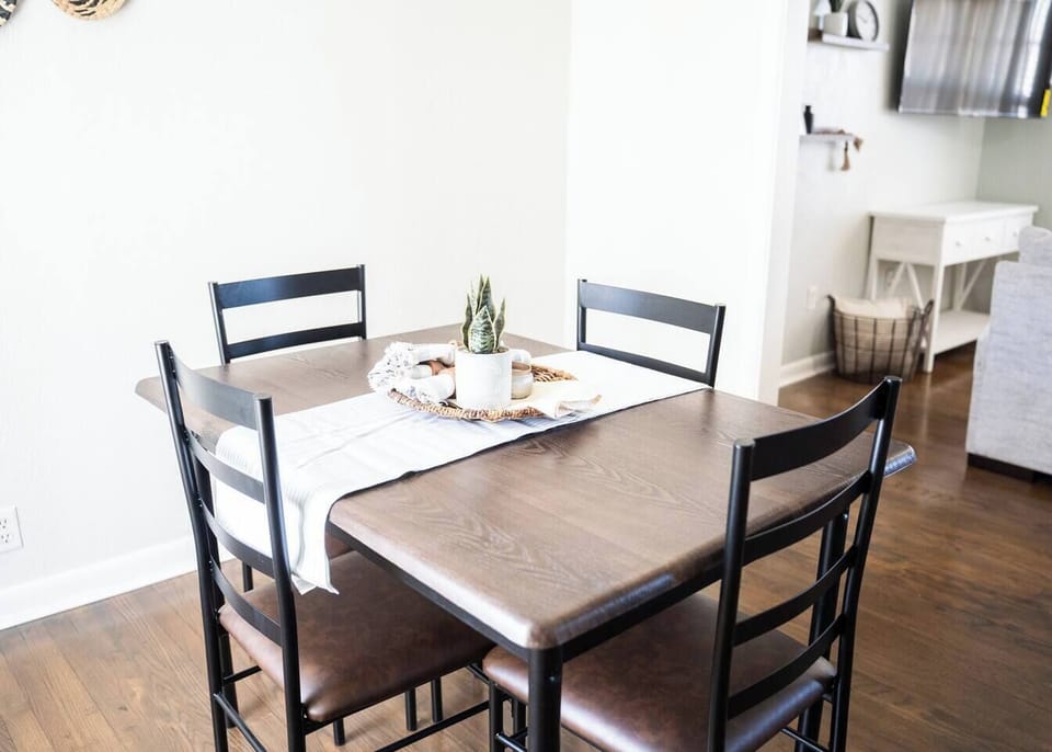 Spacious dining area with seating for four—perfect for meals or game nights.