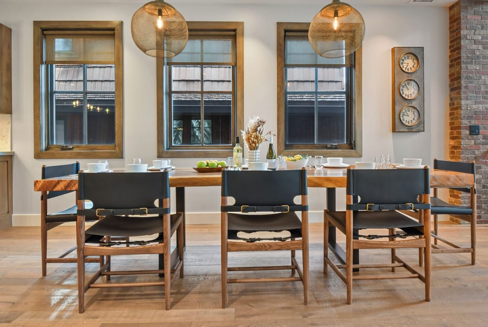 Dedicated dining space with seating for the whole group, warm lighting, and industrial character - perfect for shared meals at Foundry Haus