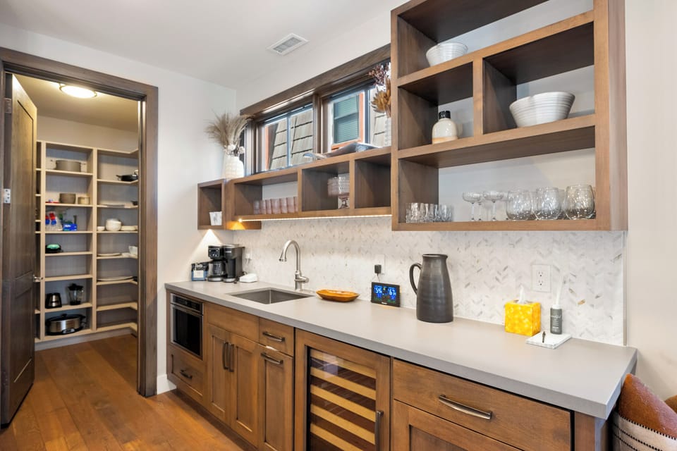 Secondary prep space with built-in storage, perfect for staging meals and keeping the main kitchen guest-ready—an APRÈS favorite feature.