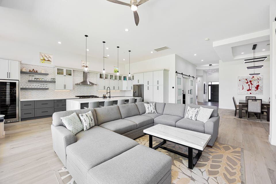 The expansive living room features a comfortable couch sure to reel everyone for cozy movie nights.