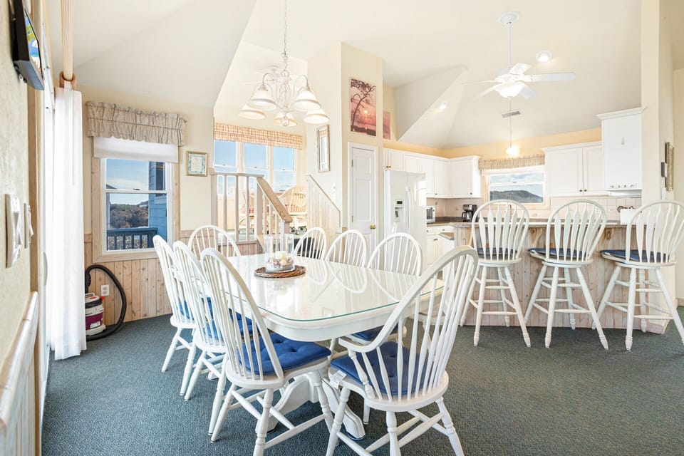 Dining Area: Spacious dining table with seating for the whole group—perfect for gathering after a day on the beach.