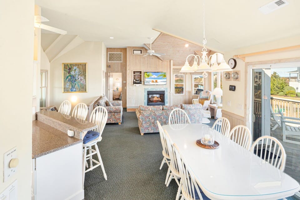 Dining Area: Spacious dining table with seating for the whole group—perfect for gathering after a day on the beach.