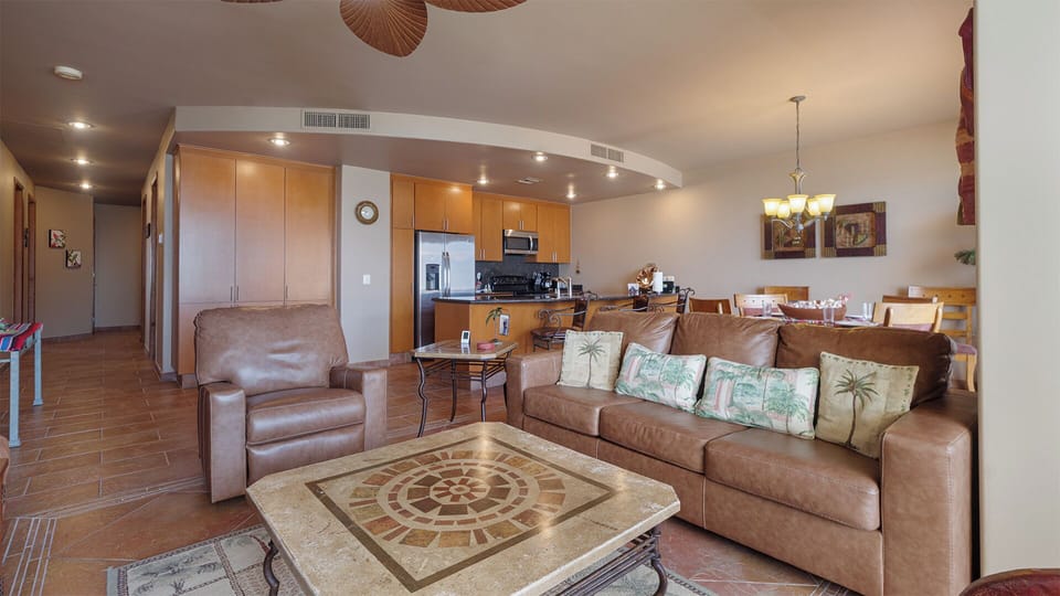 Living room area is cozy with leather seating