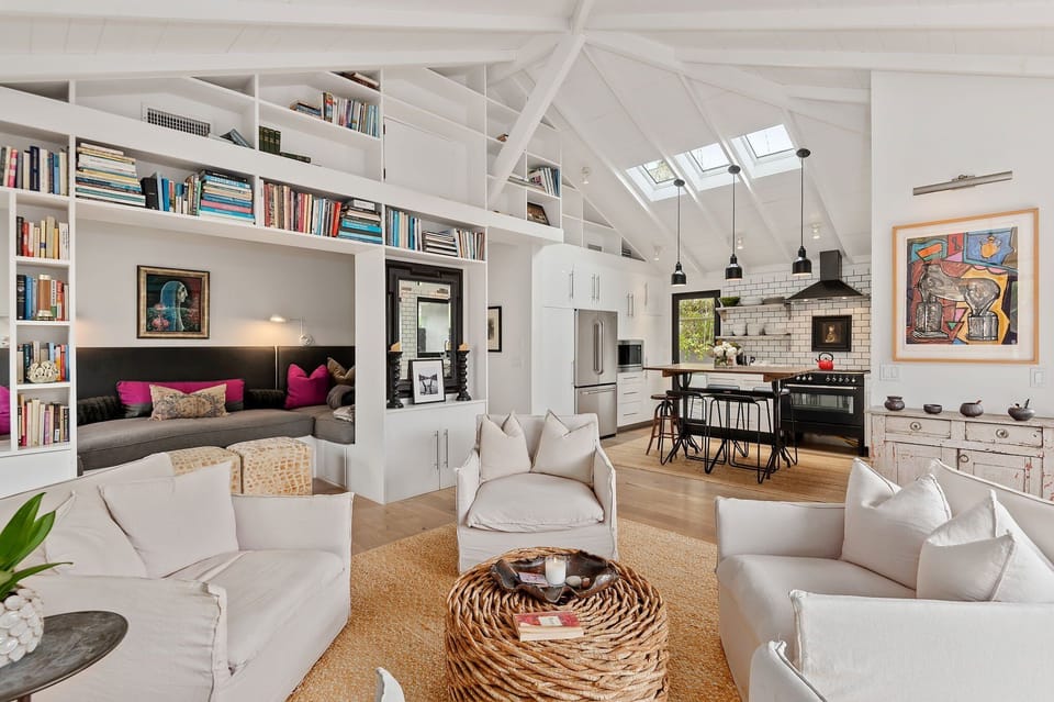 Inviting main living area with reading nook and vaulted ceilings