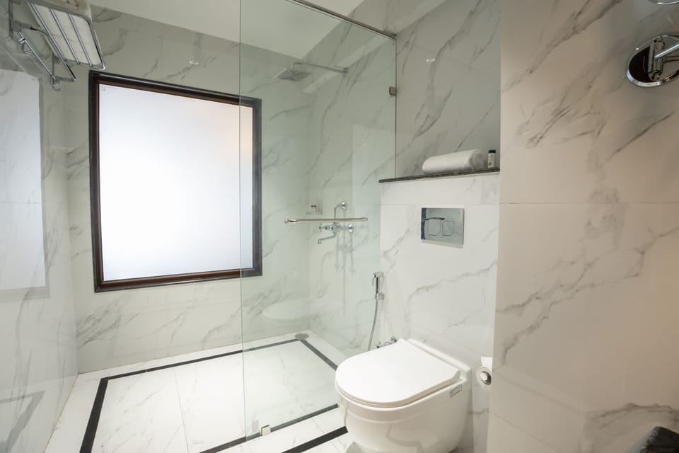 Shower, hair dryer, slippers, towels